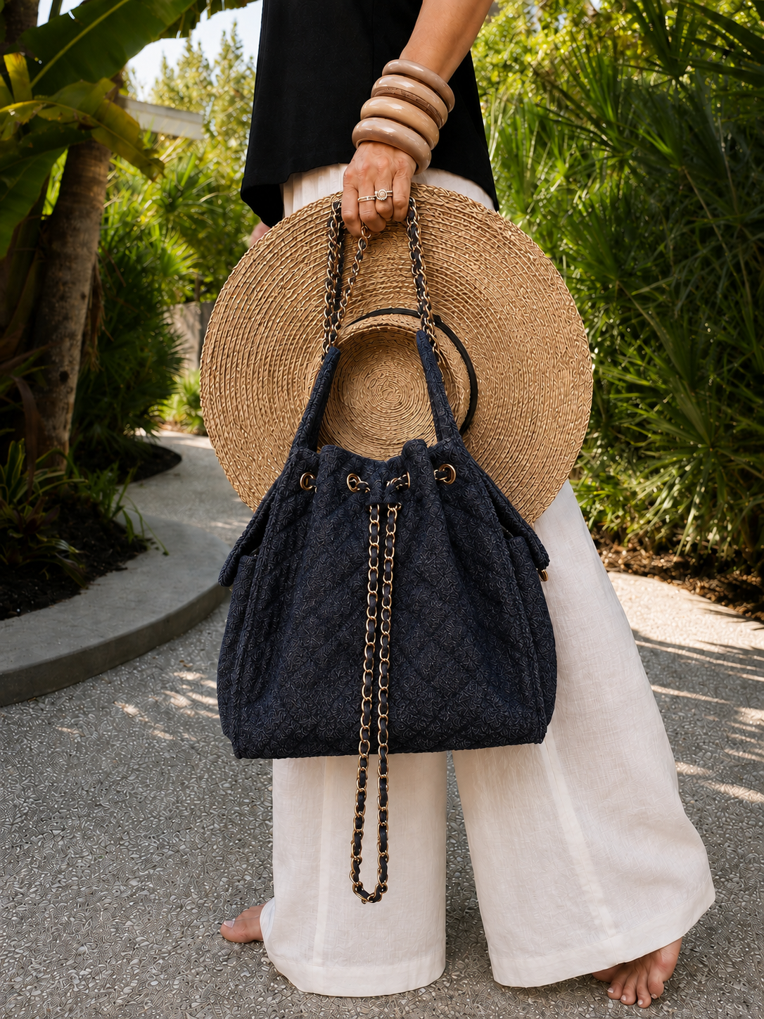Medium Bayshore Bucket Bag by BEACH HAUS in dark wash denim, featuring a casual bucket style with a drawstring closure and shoulder strap.