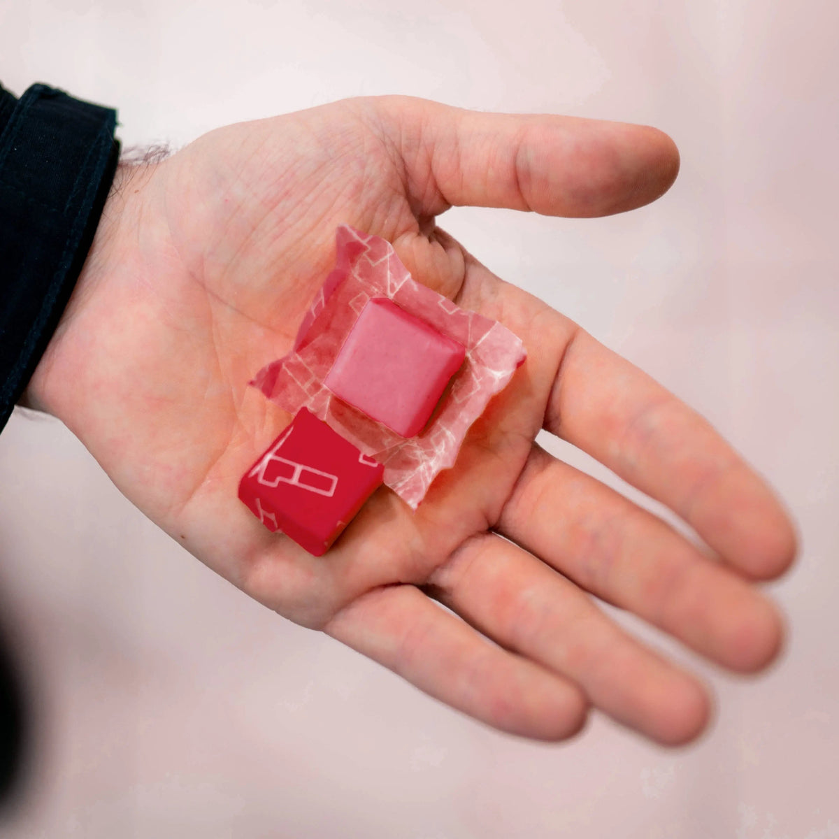 1 Shot Energy Starter Variety Stack bundle featuring assorted cherry-flavored energy chews in hand.