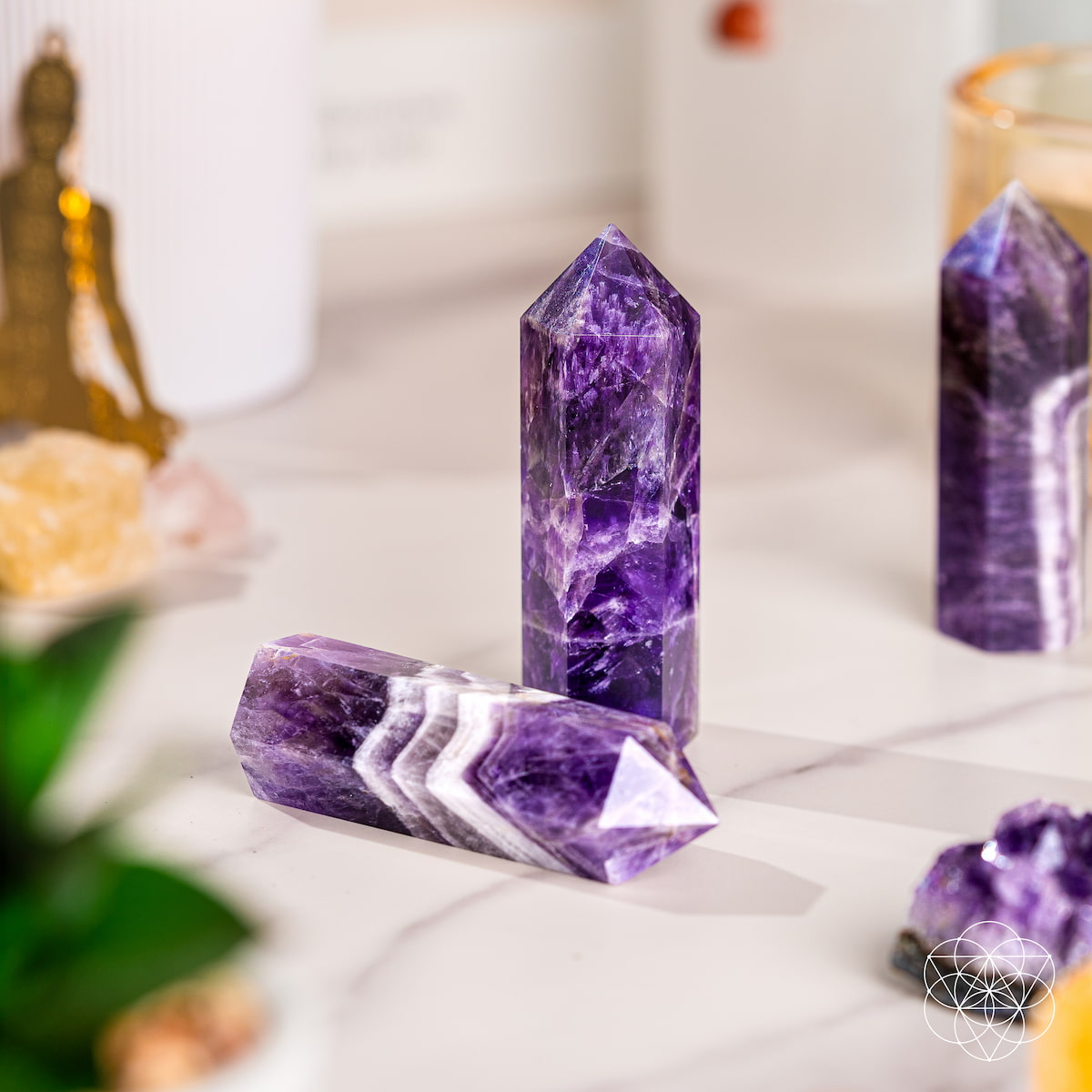 Chevron Amethyst Point of Transformation home decoration by Conscious Items, showcasing a polished purple and white crystal point.