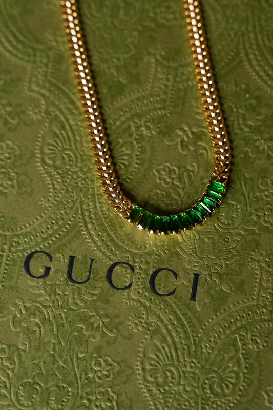 Close-up of JewelsBySunaina Marissa Cuban chain necklace showing its thick, textured gold link design.