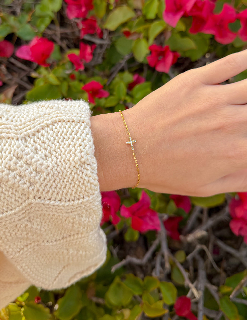 Dainty gemstone cross link bracelet by Elevated Faith featuring delicate chain and small sparkling gem accents.