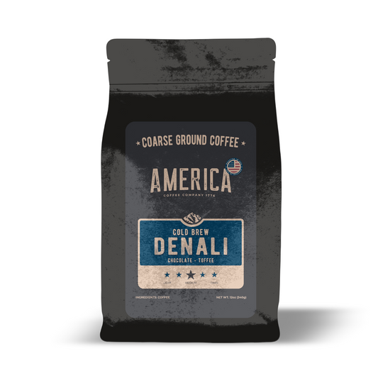 Ground Denali Cold Brew coffee from America Supply Company LLC in a dark, rich color, ready for brewing.