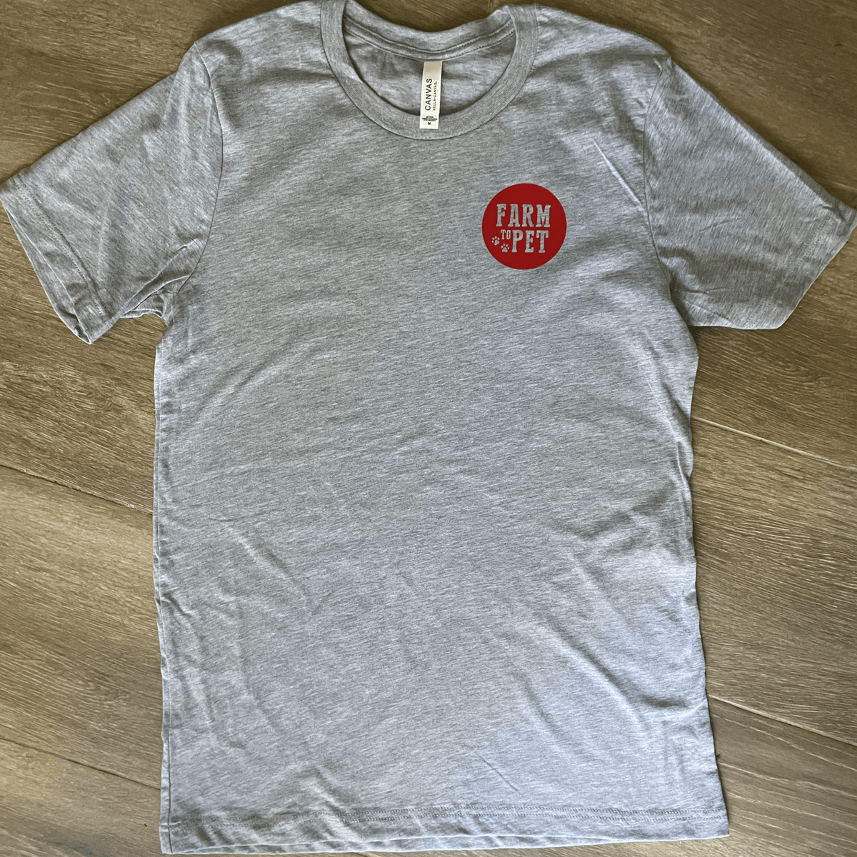 Gray Farm to Pet logo T-shirt featuring a front-facing view with a casual fit and branded design.