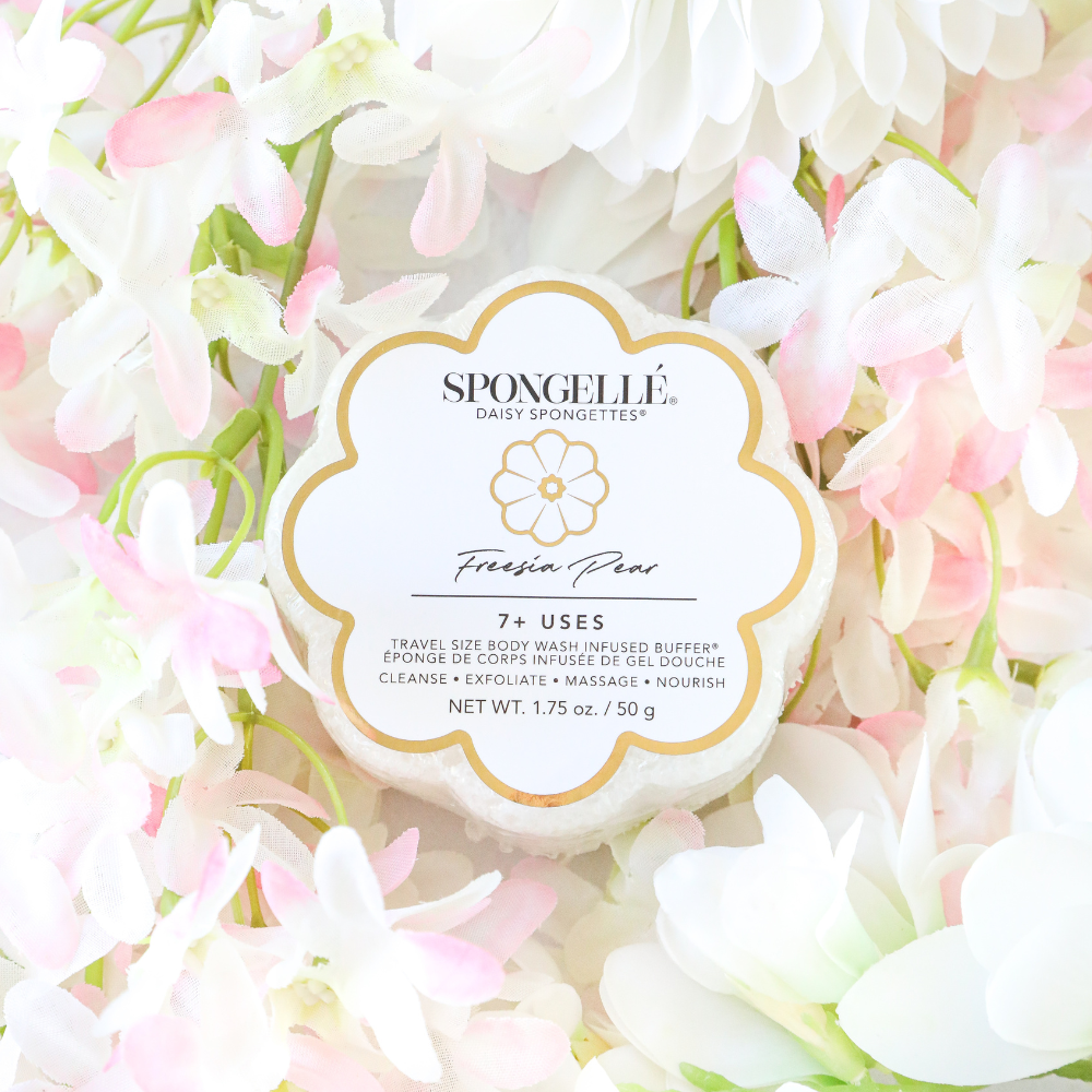 Freesia Pear Daisy Spongette body wash-infused buffer by Spongellé with a floral design and soft sponge texture for gentle cleansing.