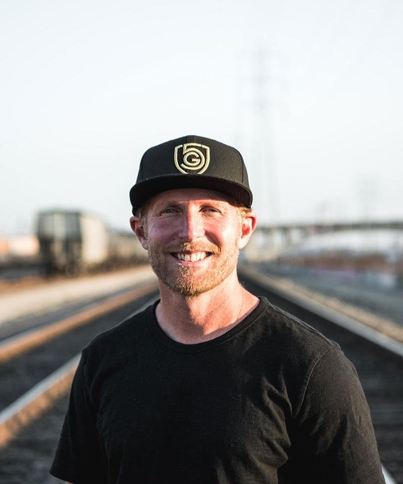 Goal Five G5 flat billed snap back hat, lifestyle style with adjustable strap and bold logo on front, black color.