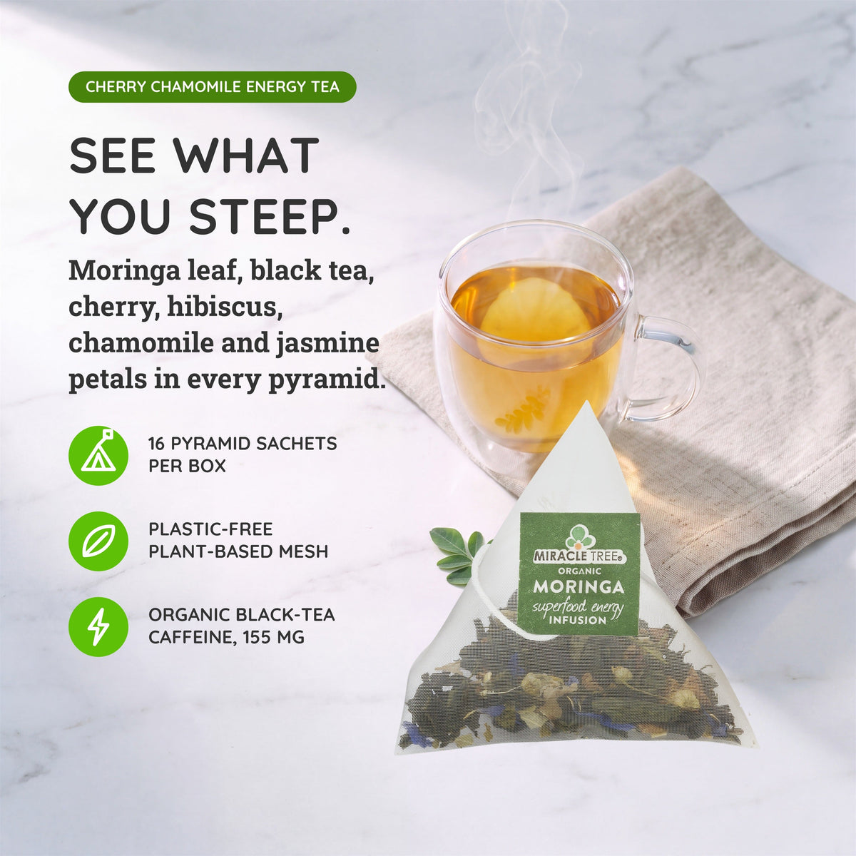 Organic Moringa Energy Tea by Miracle Tree with cherry and chamomile, natural coffee alternative, served in a clear glass cup