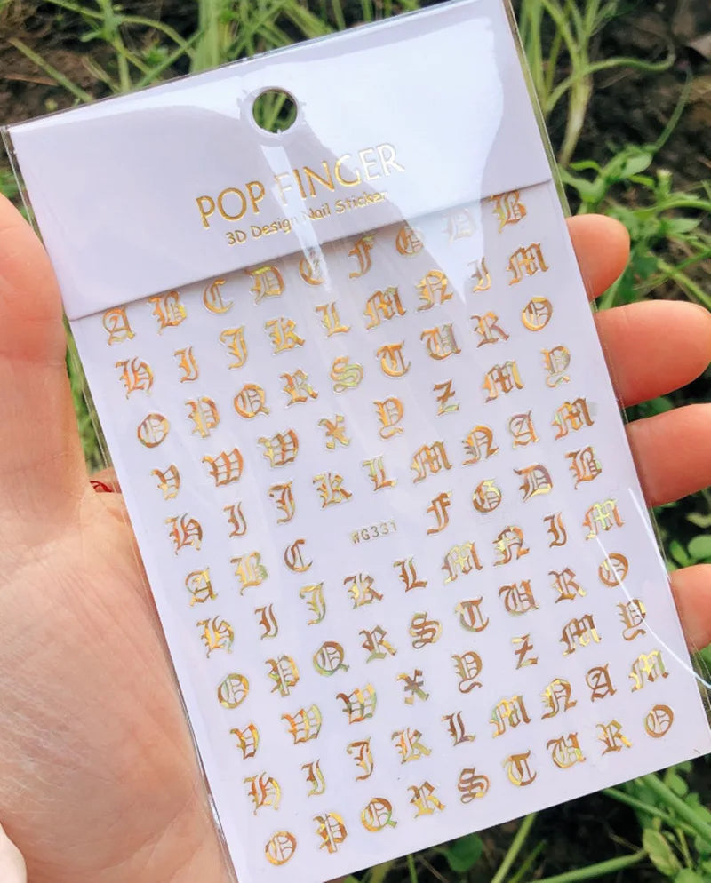 Black Old English font nail art stickers featuring alphabet letter transfers for gothic nail decoration by Blushimmer.
