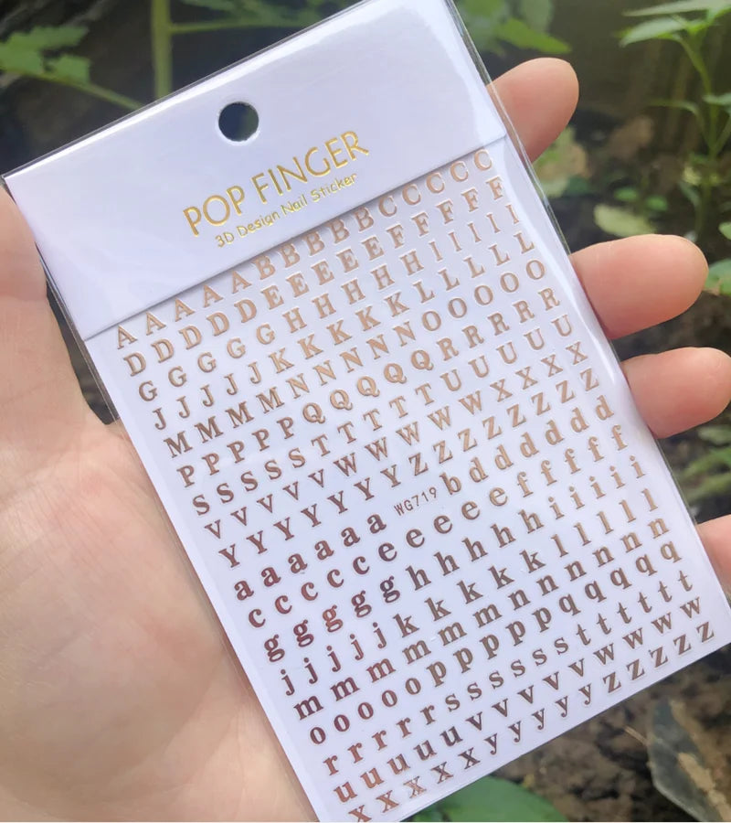 Black Old English font nail art stickers featuring alphabet letter transfers for gothic and gothic-inspired nail decoration.