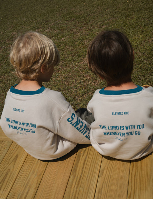 Kids crewneck shirt from Elevated Faith featuring a celestial design, perfect for children’s casual or religious wear.