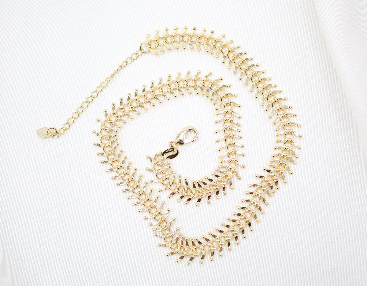 MIA Jewelry Designed Ball Spine Choker showing a black leather band with metallic ball accents on a model's neck.