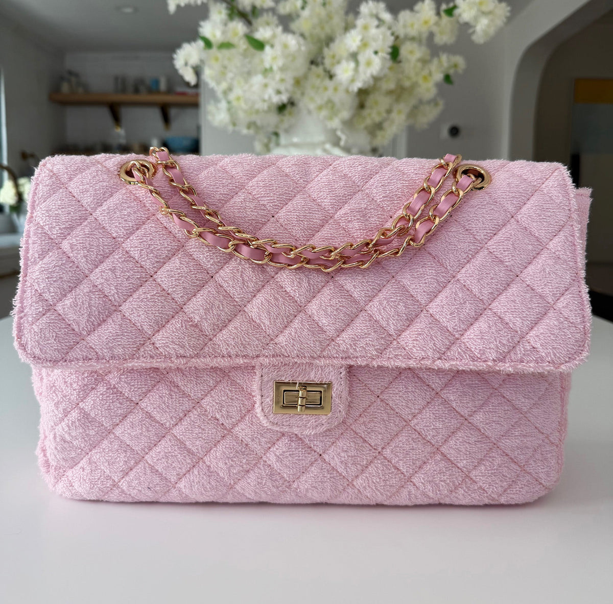 Beach Haus medium shoreline flap in blush pink with soft fabric and stylish design, perfect for casual beachwear.