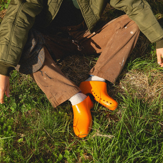 Orange Calzuro Classic clogs without holes, durable medical footwear designed for comfort and hygiene.