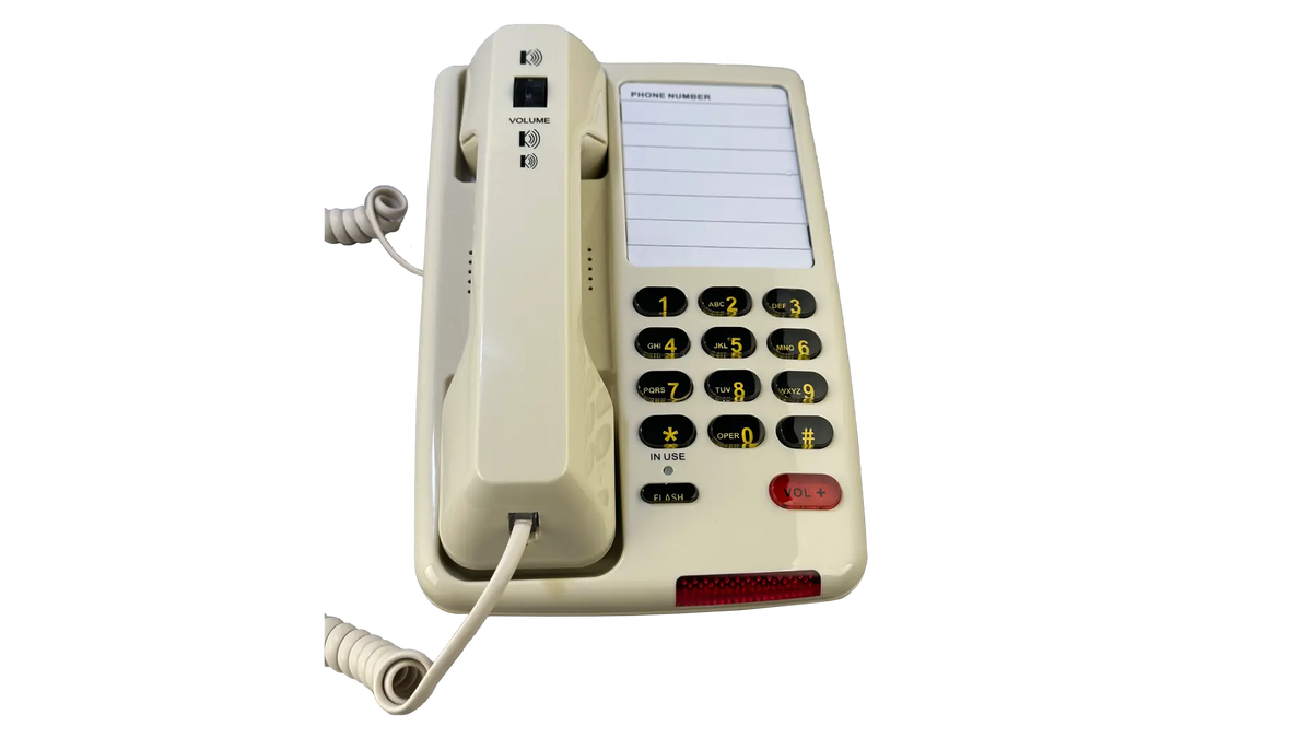 Cream MedPat Solutions D520U landline console phone with USB-A and USB-C charging ports on a table.