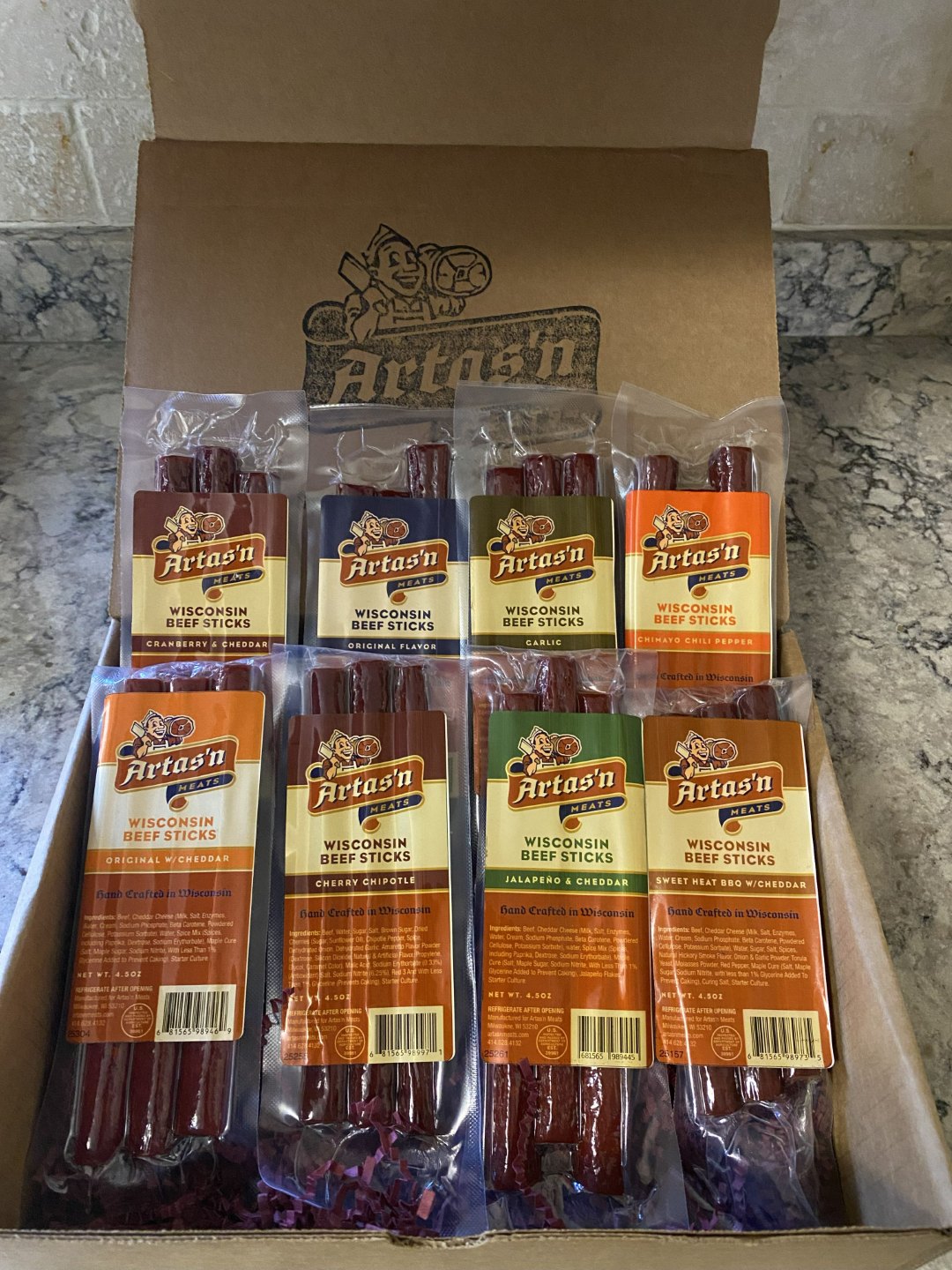 Artas'n Meats The Artas'n Eight gift box featuring assorted meat sticks arranged in a decorative box.