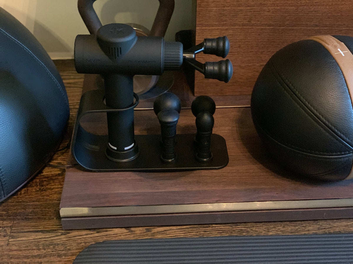 iReliev MVP+ PowerUp Charging Station for percussion massager accessories, shown with charging ports and device connections.