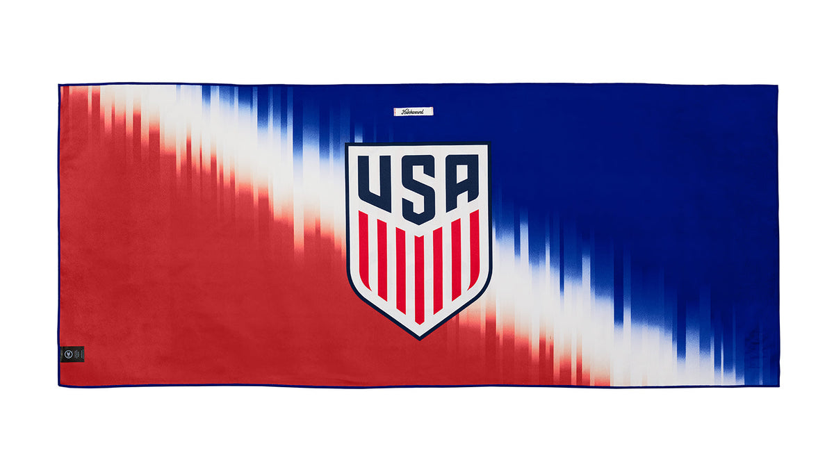 U.S. Soccer 2024 Knockaround adventure towel by Goal Five, showing a lifestyle scene with the towel featuring soccer-themed design.