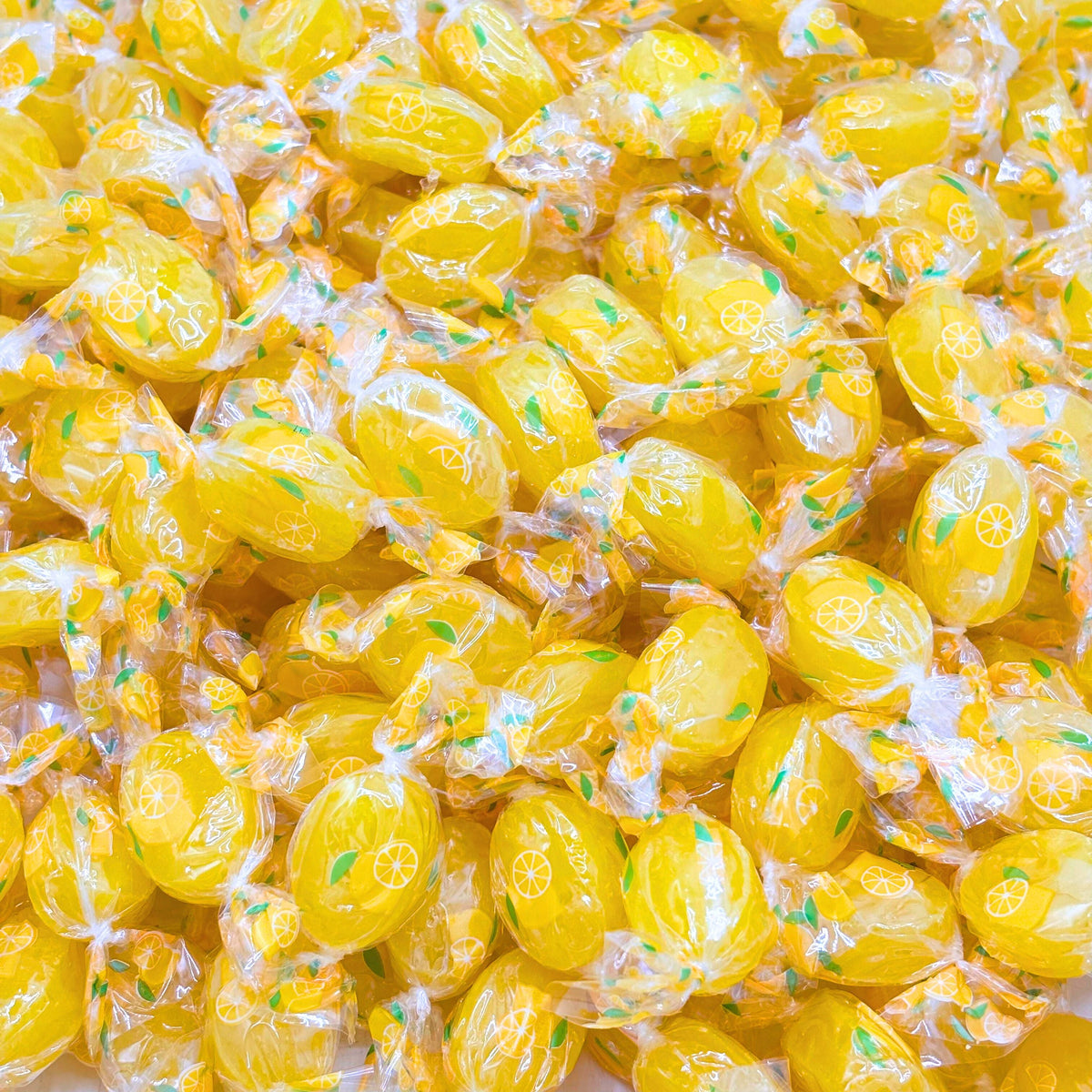 Lemon-flavored hard candy from Candy In Bulk in a large value bag, showing bright yellow candies in a clear bag.