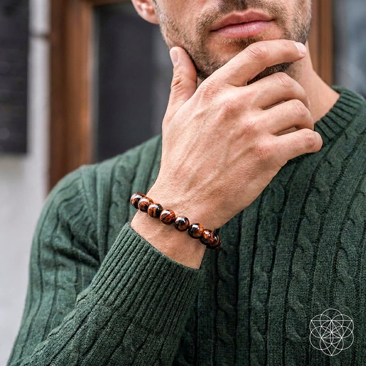 Mahogany Obsidian bracelet from Conscious Items featuring natural stone beads, worn on a person’s wrist in a lifestyle setting.