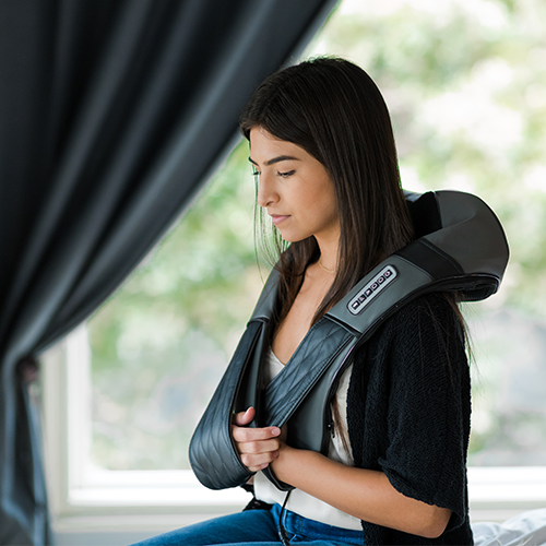 iReliev shiatsu neck and back massager in use, showing ergonomic design and soothing massage nodes for relief.