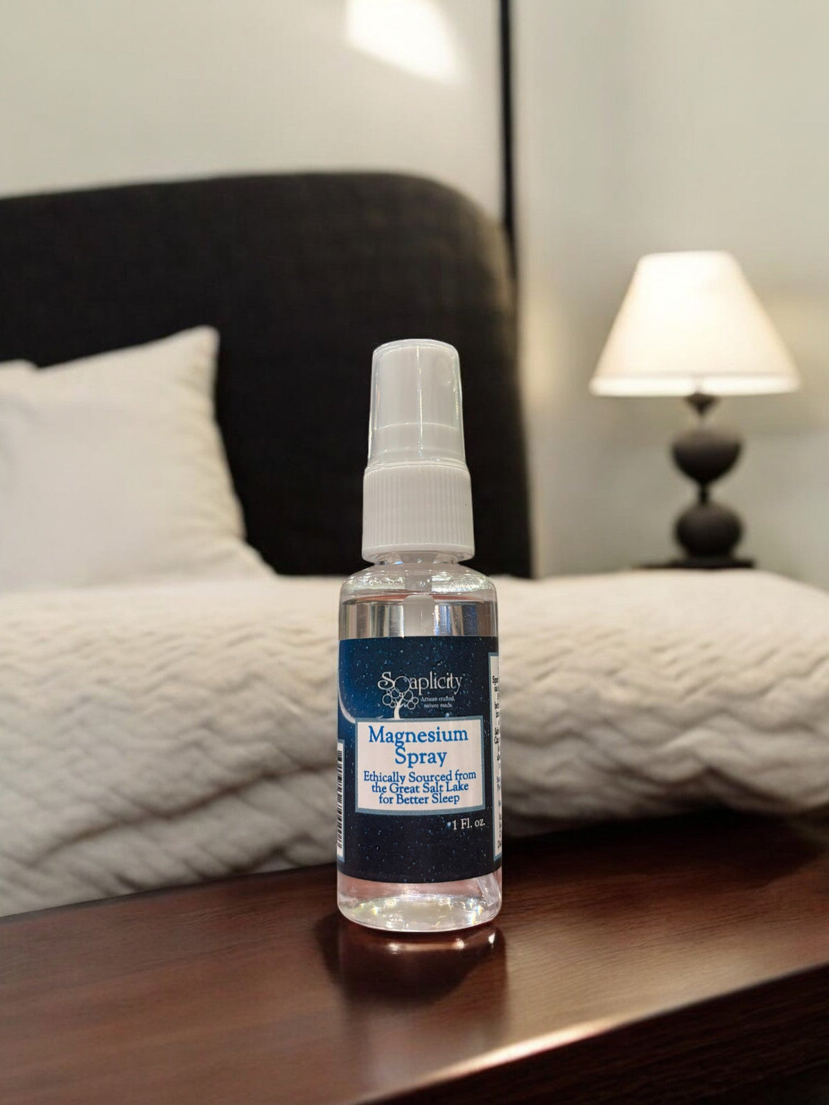 Soaplicity magnesium oil spray bottle for sleep aid and muscle recovery, 1 oz, with a clear spray nozzle and label.