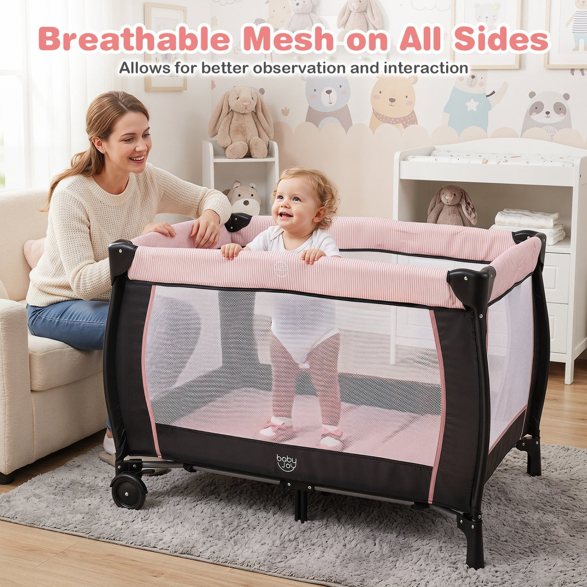 Pink baby playpen with changing table and bassinet, featuring a safe, multi-functional design for infants and toddlers.