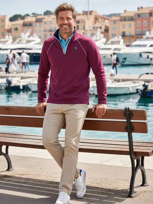 White Water Life Harbor Plum quarter zip sweater laid on a bench, showcasing its comfortable, casual design and soft fabric.
