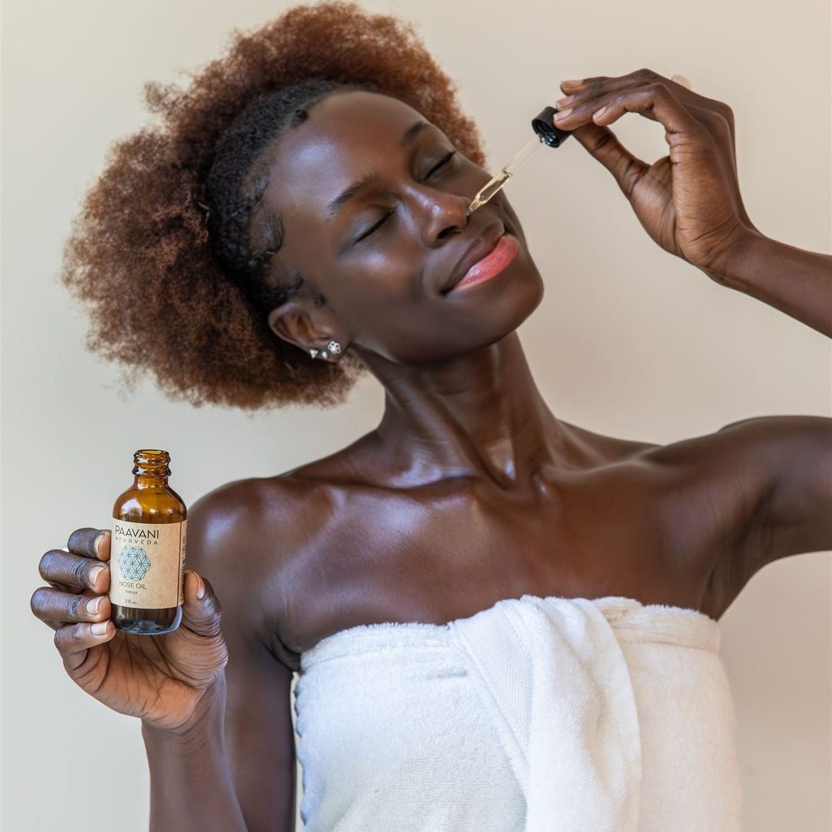 Paavani Ayurveda Nasya Oil in a glass dropper bottle, Ayurvedic nose oil for deep breathing and nasal relief.