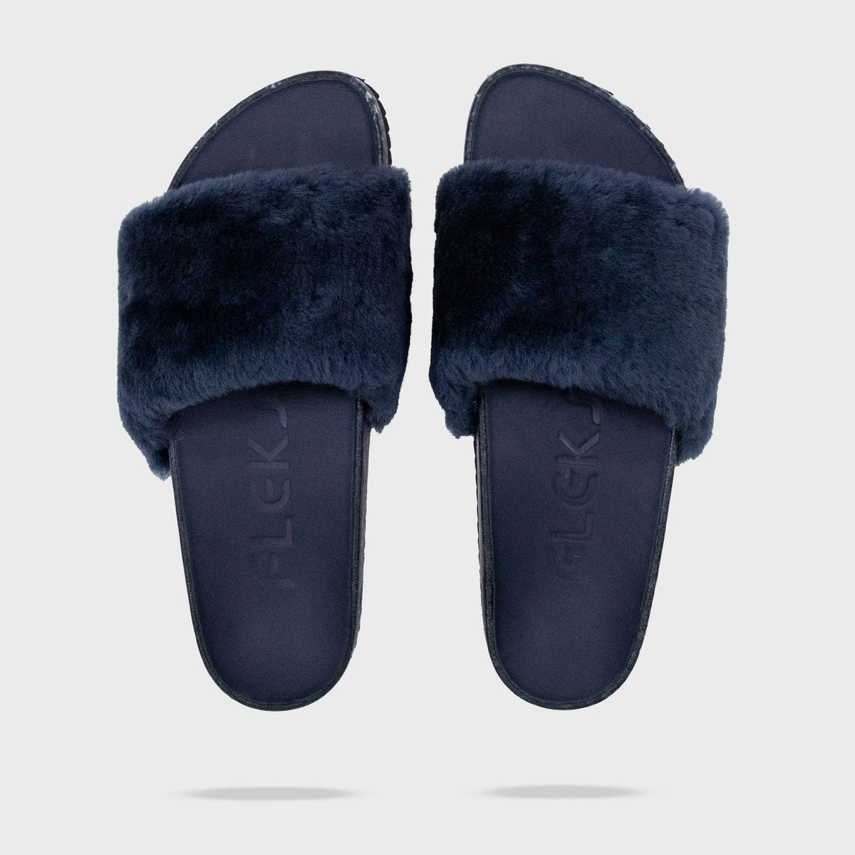 Fleks San Ysidro Slide in Deep Blue Sea, showing a comfortable sandal with a minimalist design and textured sole.
