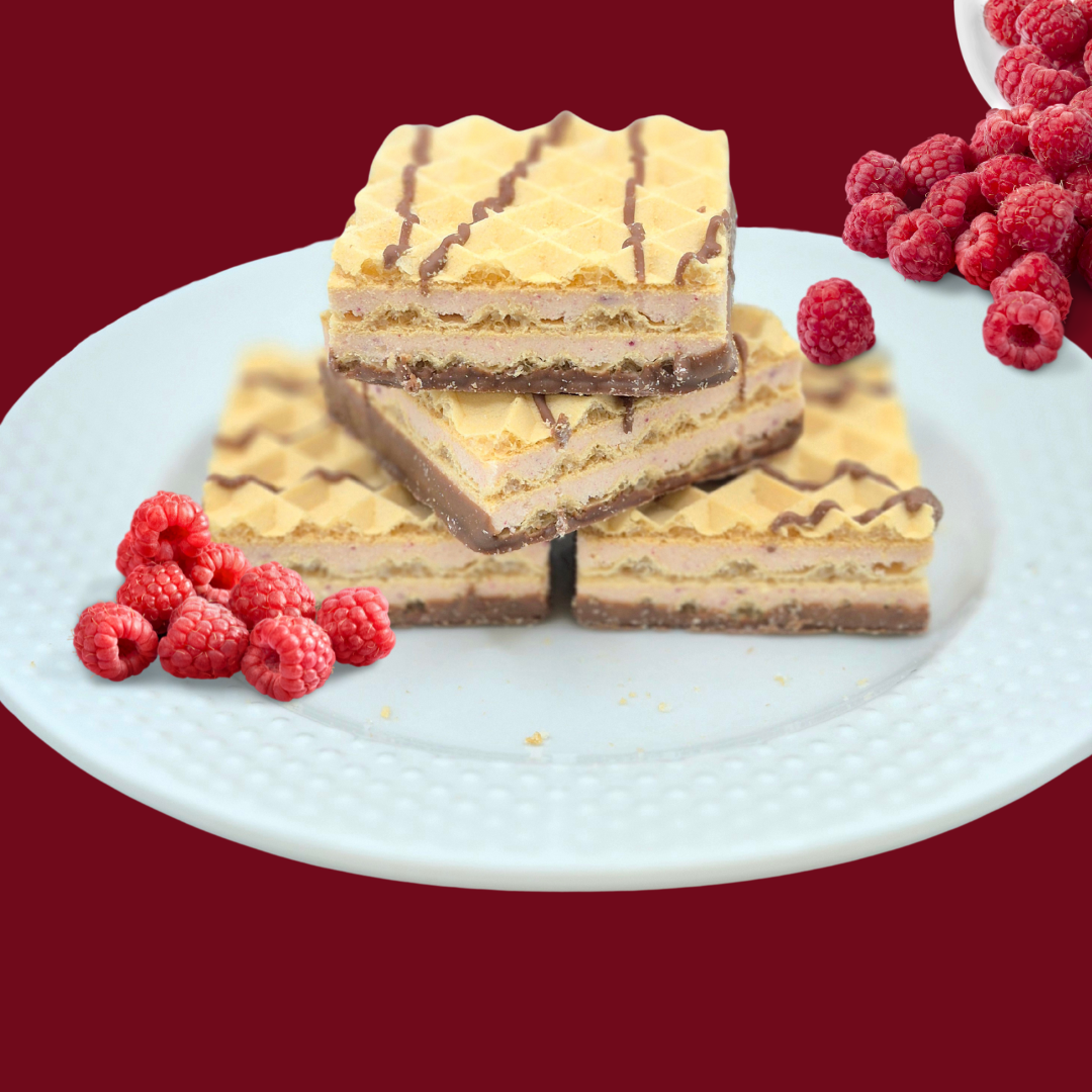 AmBari Nutrition Proti Wafer Squares with raspberry flavor, showing a stack of chocolate-covered wafer bars with raspberry filling.
