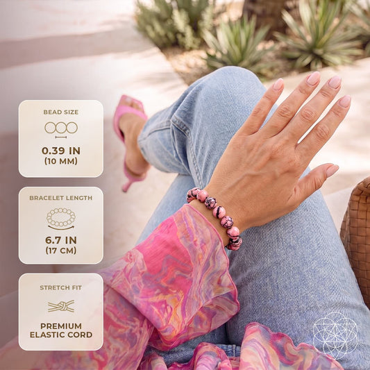 Rhodonite bracelet of forgiveness from Conscious Items featuring pink and black beads on an elastic band.