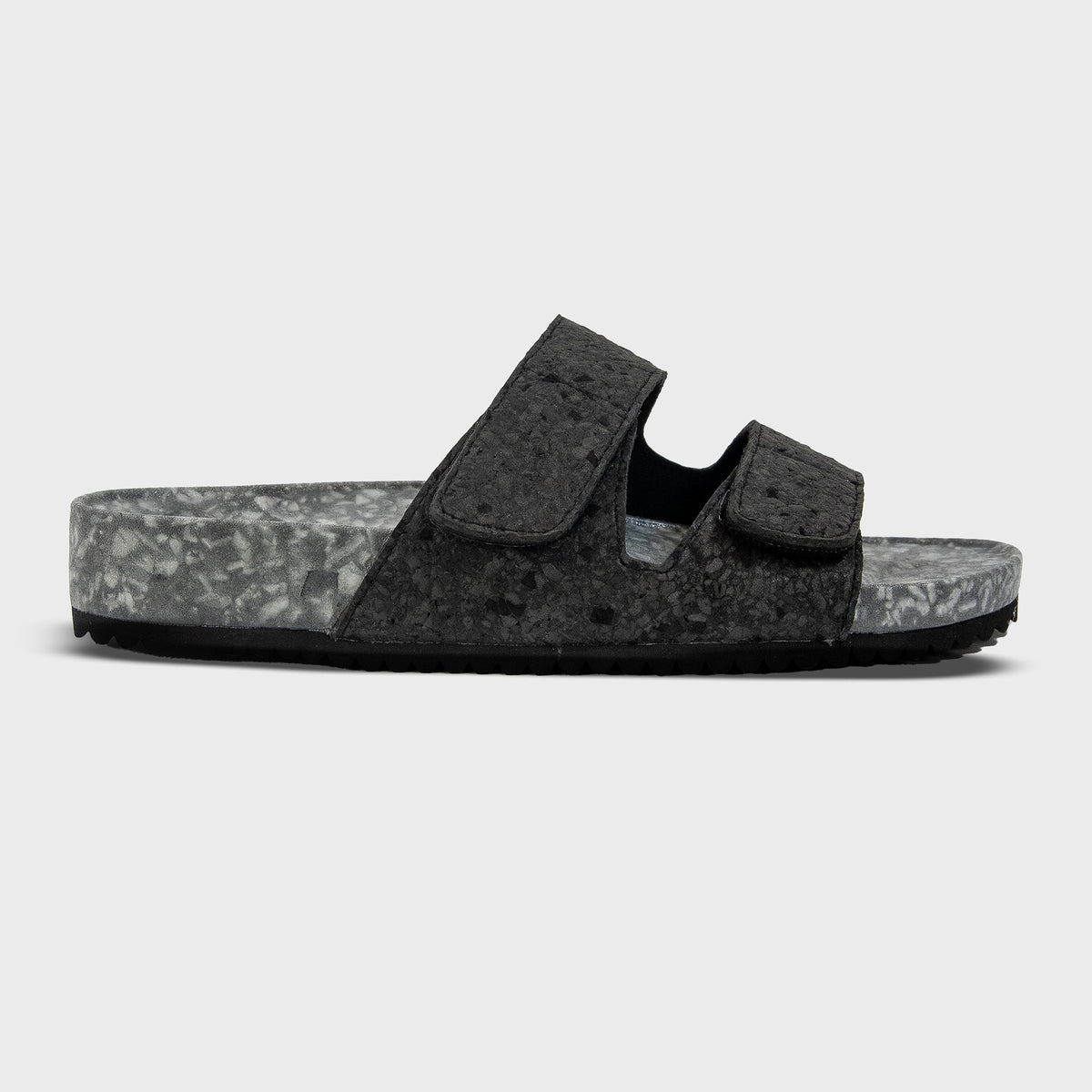 Riviera Fleks Nightfall sandal featuring a sleek profile, dark color, and stylish design suitable for casual wear.