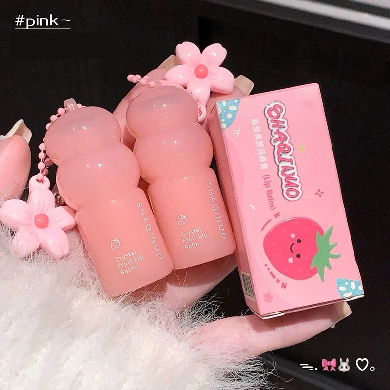 Blushimmer Crystal Strawberry Lip Balm stick featuring a key chain, moisturizing hydrating lip care with color-changing effects for smooth lips.