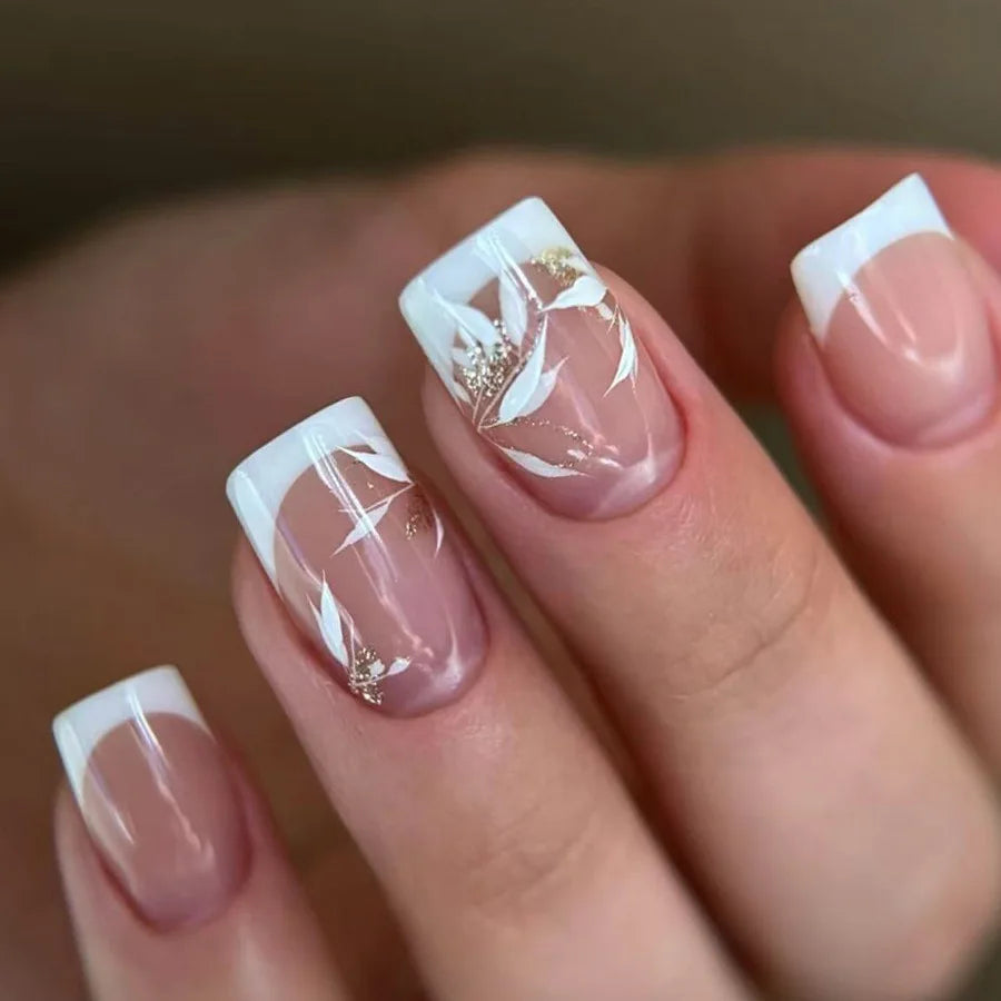 Set of 24 Blushimmer square head fake nails with pink and white gradient French press design on short full cover nail tips.