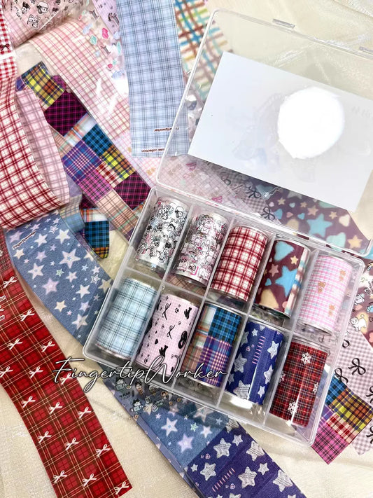 Blushimmer nail art transfer paper with 10 rolls of plaid and star-themed foil stickers for manicure decoration and nail design.