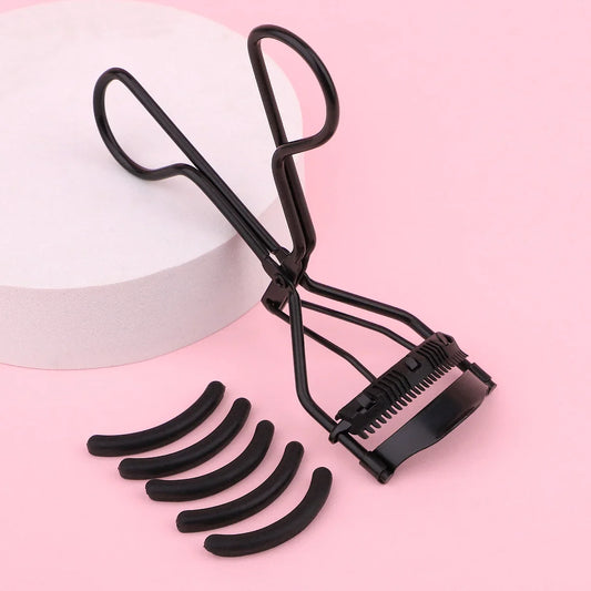 Portable Blushimmer eyelash curler with stainless steel design and five silicone pads for shaping big, natural eyelashes.