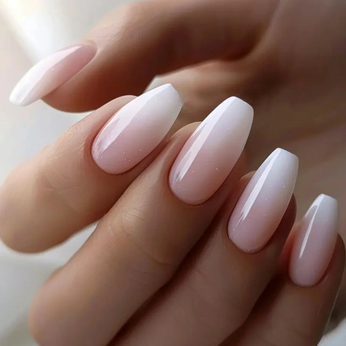 Set of 24 Blushimmer square head fake nails with pink and white gradient, short full cover tips with jelly glue for elegant French press look.