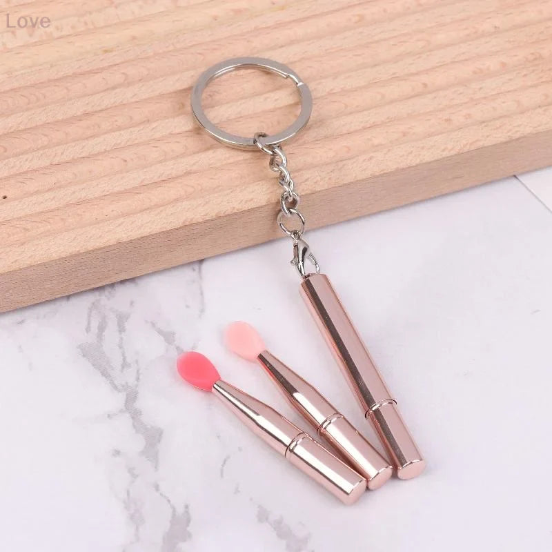 Blushimmer portable silicone lip brush with cover and keychain, ideal for lipstick and eyeshadow application.