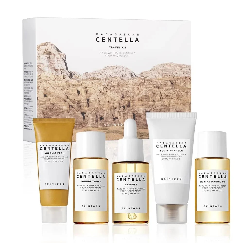SKIN1004 Madagascar Centella travel skincare kit with toner, ampoule, soothing cream, cleansing oil, and foam in mini size.