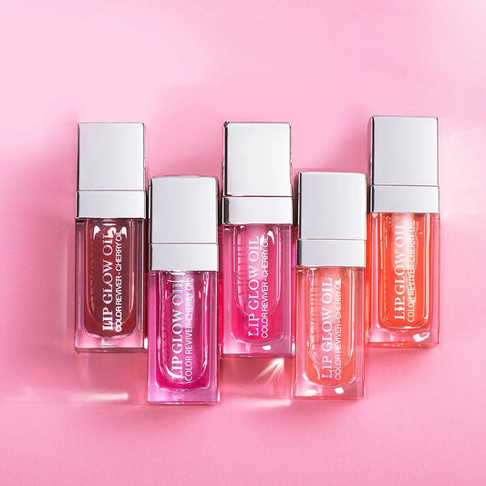 Blushimmer Hydrating Lip Glow Oil in transparent tint, moisturizing plumping lip gloss with a sleek applicator for dry lips.