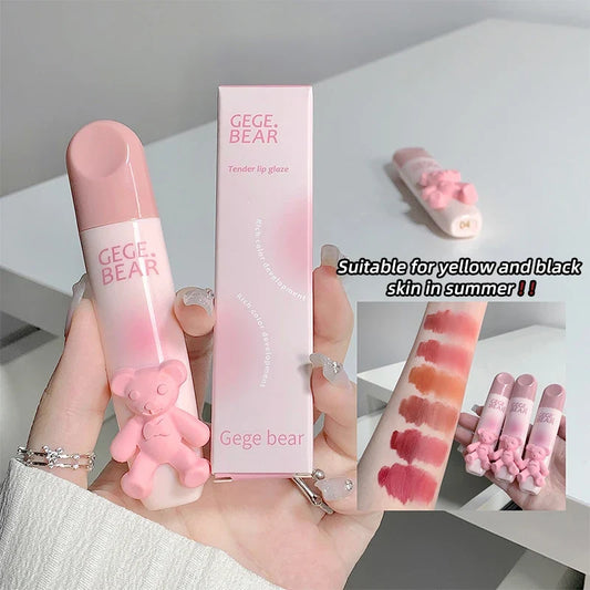Blushimmer bear-shaped lip glaze and matte lipstick with creamy, whitening lip color and velvet finish, held in hand.
