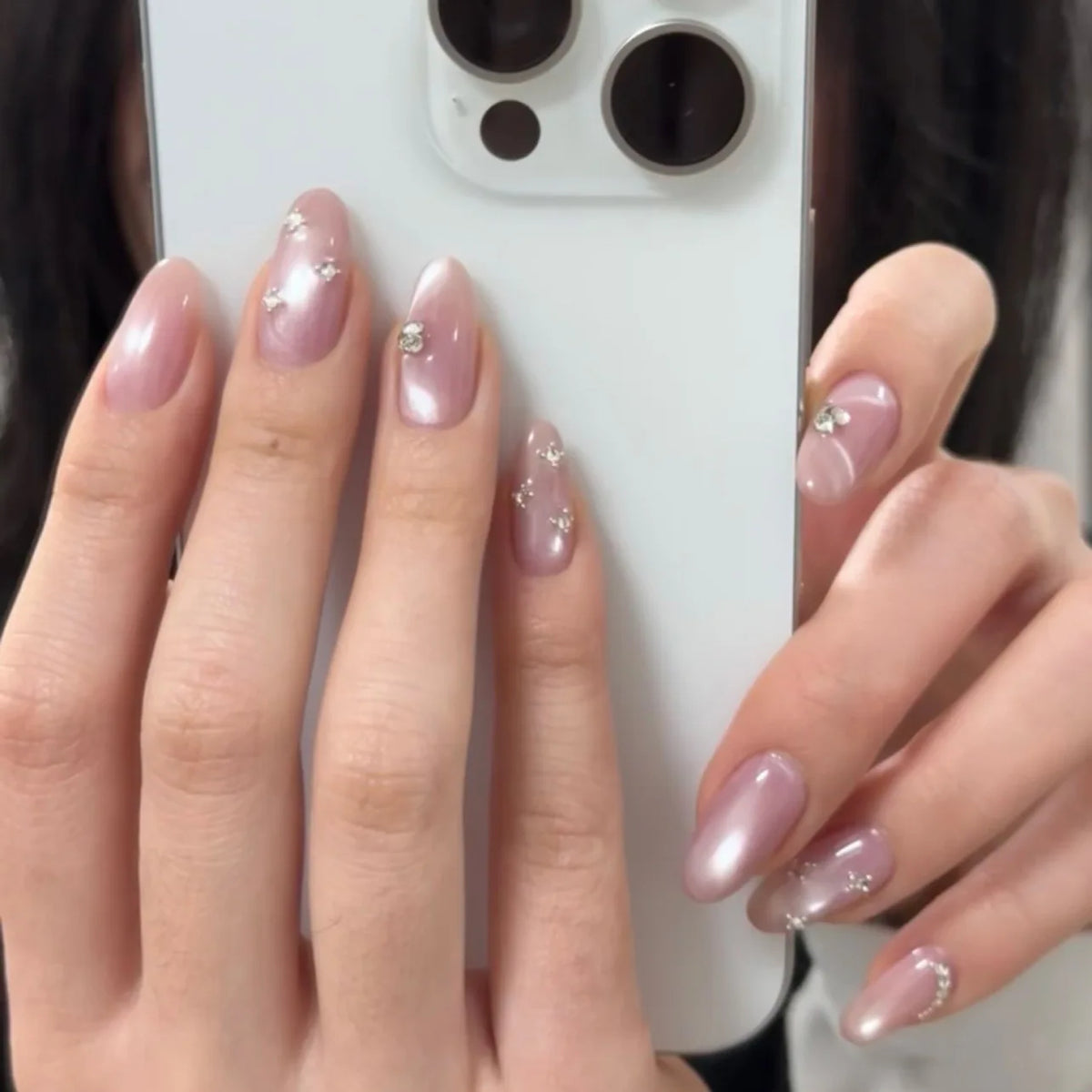Set of 24 glossy red Cat's Eye press-on nails by Blushimmer, almond-shaped, full cover false nails with nude color finish.
