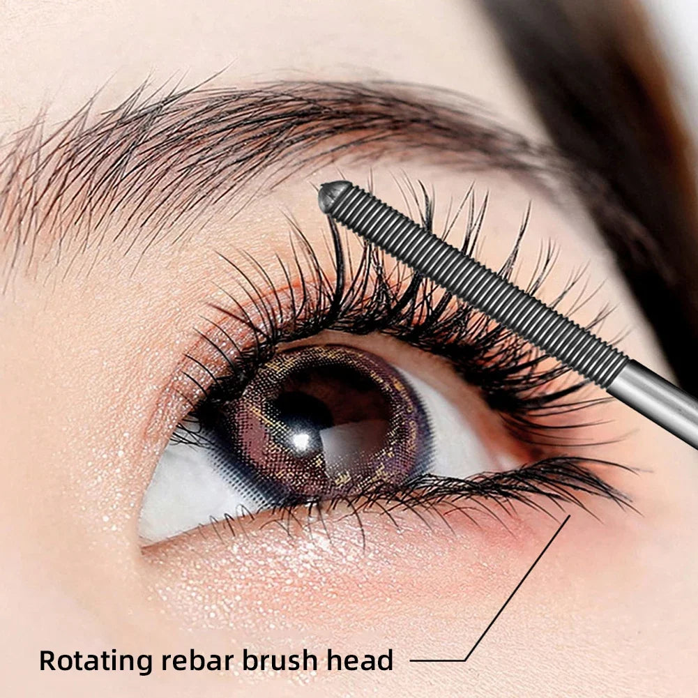Black waterproof silk fiber mascara in a metal tube by Blushimmer, featuring long, curled lashes and non-clumping eyelash extension.