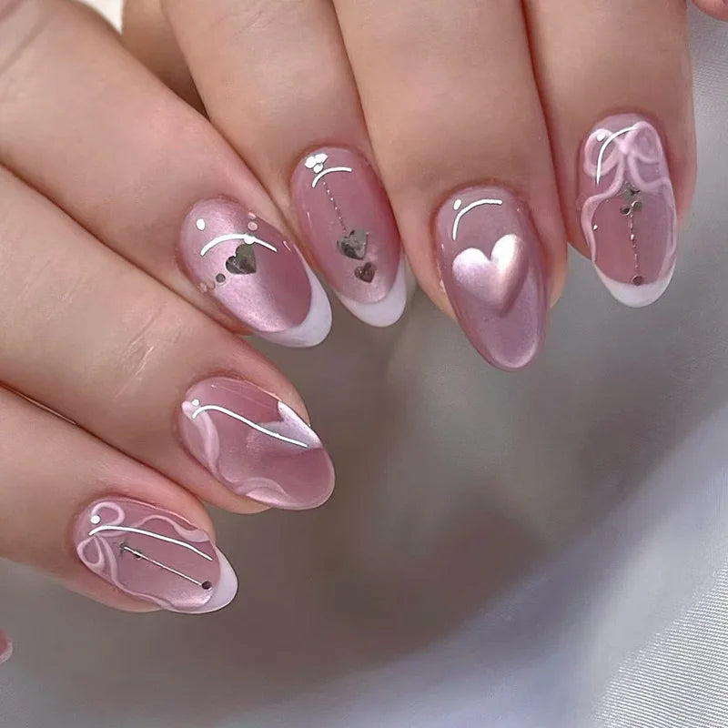 Set of 24 glossy red cat's eye press-on nails by Blushimmer, full cover almond-shaped false nails with nude color and charms.