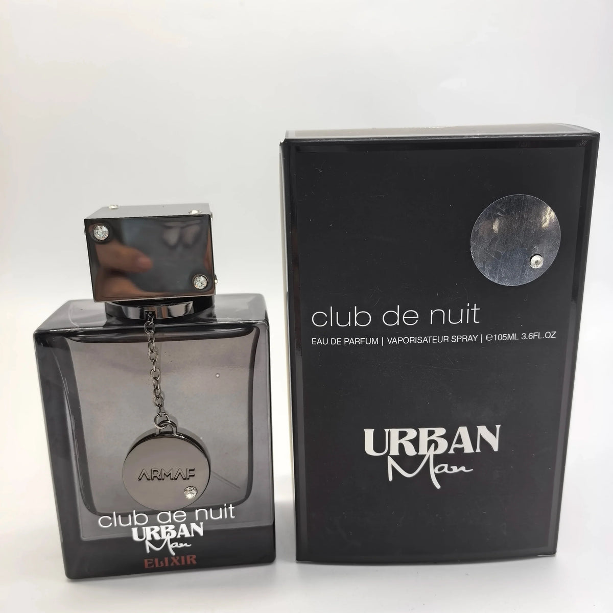 Armaf Club De Nuit Urban Man Elixir EDP 105ml bottle with bold woody amber scent, unisex perfume, ideal holiday gift