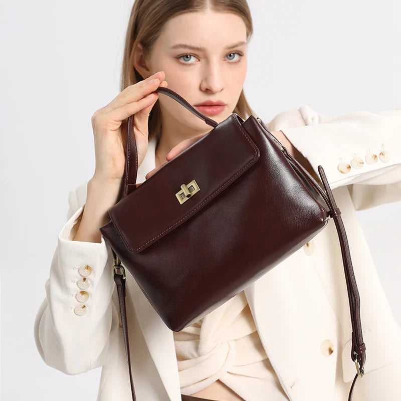 Women's genuine leather crossbody satchel from NNEOBA with adjustable strap and spacious interior, casual shoulder bag for everyday use.