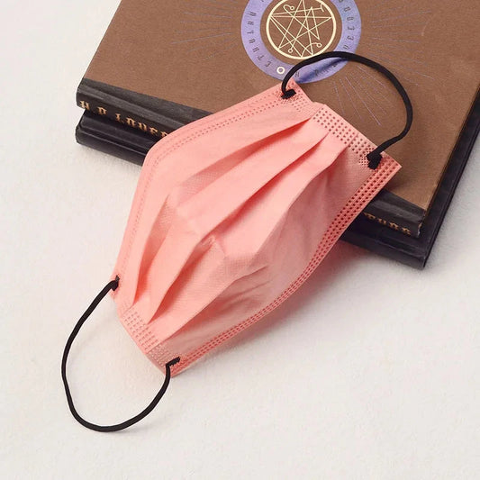 200-pack thick pink Sakura disposable face masks with elastic bands and adjustable nose clips, ideal for travel and outdoor activities.