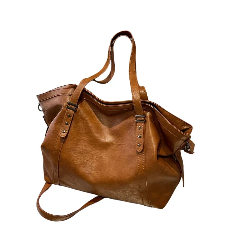 Brown leather women's tote shoulder crossbody bag by OBA featuring spacious interior and sleek design for everyday use.