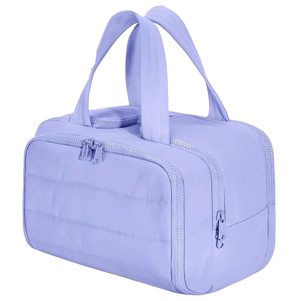 Large waterproof cosmetic bag by Blushimmer, travel toiletries organizer with multiple compartments for shower and makeup essentials.