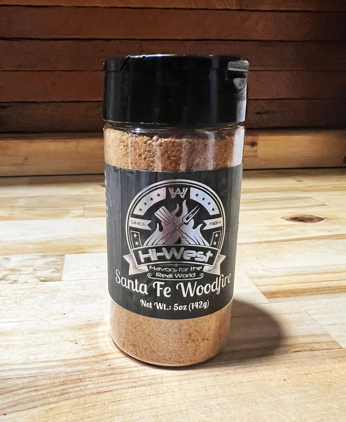 Hi-West Santa Fe Woodfire Seasoning jar showing colorful spice blend in a clear container, ideal for grilling and flavorful dishes.