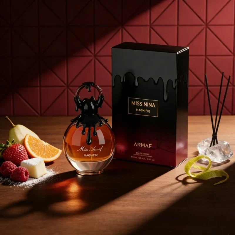Blushimmer feminine fruity perfume bottle with soft pink and gold accents, 100ml, elegant design, showcasing a luxurious aroma.